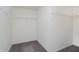 Empty white walk-in closet with shelving along the walls and neutral colored carpet at 6101 Hardwick Dr, Whitestown, IN 46075