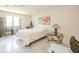 Serene bedroom with a patterned bedspread, accent furniture, and a calming ambiance for relaxation and rest at 618 N Buckingham Ct, Anderson, IN 46013