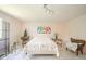 Bright and airy bedroom with a floral-patterned bed, decorative accents, and a cozy atmosphere for restful nights at 618 N Buckingham Ct, Anderson, IN 46013