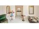 Stylish hallway featuring elegant mirrors, artistic decor, and transitional elements, enhancing the home's aesthetic appeal at 618 N Buckingham Ct, Anderson, IN 46013