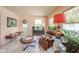 Cozy living area with a neutral color scheme, inviting seating, and natural light creating a welcoming ambiance at 618 N Buckingham Ct, Anderson, IN 46013