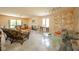 Bright living room featuring marble floors, a fireplace, and unique wicker furnishings for relaxed comfort at 618 N Buckingham Ct, Anderson, IN 46013