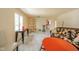 Open-concept living room with marble floors and wicker furniture offering unique character at 618 N Buckingham Ct, Anderson, IN 46013