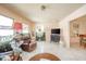 Bright living room with tile floors, large windows, and comfortable seating creating an inviting and relaxing atmosphere at 618 N Buckingham Ct, Anderson, IN 46013