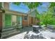 Back patio featuring a brick exterior, fire pit and ample space for outdoor enjoyment, with mature trees at 6334 Teak Ct, Indianapolis, IN 46217