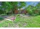 Expansive backyard with lush greenery and a charming multi-level patio, perfect for outdoor gatherings at 6334 Teak Ct, Indianapolis, IN 46217