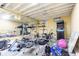 Unfinished basement featuring exercise equipment, mirrors, and plenty of space at 6334 Teak Ct, Indianapolis, IN 46217