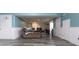 Basement with hard surface floors, aqua walls, white trim, and cozy seating arrangement at 6334 Teak Ct, Indianapolis, IN 46217