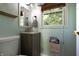 Cozy half-bathroom with updated fixtures and a window at 6334 Teak Ct, Indianapolis, IN 46217