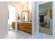 Full bathroom with double sinks and a large mirror at 6334 Teak Ct, Indianapolis, IN 46217