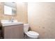 Compact bathroom featuring modern vanity, neutral walls, and a toilet at 6334 Teak Ct, Indianapolis, IN 46217