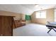 Bright bedroom with carpet, large window, and dresser with ceiling fan at 6334 Teak Ct, Indianapolis, IN 46217