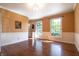 Open dining room area with hardwood floors and bright windows providing natural light at 6334 Teak Ct, Indianapolis, IN 46217