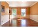 Bright dining room featuring hardwood floors, large windows, and neutral paint at 6334 Teak Ct, Indianapolis, IN 46217