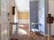 The spacious foyer showcases hardwood floors, neutral wall colors, and decorative furniture at 6334 Teak Ct, Indianapolis, IN 46217