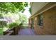 Exterior showcasing the wooden deck with views, complemented by brick and siding finishes at 6334 Teak Ct, Indianapolis, IN 46217