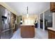 Spacious kitchen showcasing stainless steel appliances, a center island, and open floor plan at 6334 Teak Ct, Indianapolis, IN 46217