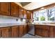 Well-maintained kitchen featuring wood cabinets, stainless steel appliances and a bright window at 6334 Teak Ct, Indianapolis, IN 46217