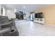 Open-concept living room with marble floors and a decorative fireplace at 6334 Teak Ct, Indianapolis, IN 46217