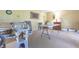 Spacious living room featuring bright natural light and a neutral carpeted floor at 6334 Teak Ct, Indianapolis, IN 46217