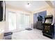 Cozy living room with sliding glass doors, an arcade game, and a comfortable seating area at 6334 Teak Ct, Indianapolis, IN 46217