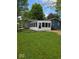 Expansive backyard with attached sun room at 706 Alexander St, Greenwood, IN 46143