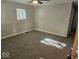 Spacious bedroom with new carpeting, ample natural light, and neutral paint tones, ready for customization at 706 Alexander St, Greenwood, IN 46143