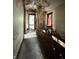 A hallway with old wallpaper holds lots of possibilities at 715 S Anderson St, Elwood, IN 46036