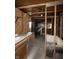 A kitchen with exposed framework shows lots of potential at 715 S Anderson St, Elwood, IN 46036