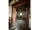 Renovation opportunity, a living room reveals exposed brick accents and unfinished ceiling ready for personalization at 715 S Anderson St, Elwood, IN 46036