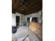 A room with exposed framework awaits renovation at 715 S Anderson St, Elwood, IN 46036