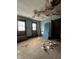 A bedroom with peeling paint awaits renovation at 715 S Anderson St, Elwood, IN 46036