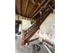 View of an ornate wood staircase under renovation at 715 S Anderson St, Elwood, IN 46036