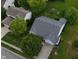 This aerial perspective reveals a house with a pristine lawn and verdant trees in a serene neighborhood setting at 7156 Chemistry Ct, Indianapolis, IN 46239
