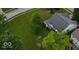 An aerial view of a home showcases lush, green landscaping and a well-maintained exterior at 7156 Chemistry Ct, Indianapolis, IN 46239