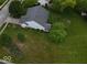 An aerial shot showcases a backyard of a home with lush landscaping and well-maintained lawn at 7156 Chemistry Ct, Indianapolis, IN 46239