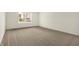 Large bedroom featuring neutral carpeting, natural light, and a calming atmosphere at 7156 Chemistry Ct, Indianapolis, IN 46239