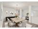 Bright dining room featuring a wooden table, chandelier, and stylish decor at 7156 Chemistry Ct, Indianapolis, IN 46239