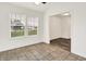Bright dining room featuring tile floors, two windows, and an open doorway to the next room at 7156 Chemistry Ct, Indianapolis, IN 46239