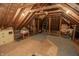 Unfinished attic featuring exposed wood beams and flooring for storage or flexible living space at 7400 Oakbay Dr, Noblesville, IN 46062