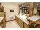 The basement bar area has white countertops, beautiful wooden cabinetry, and a sink at 7400 Oakbay Dr, Noblesville, IN 46062