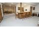 Basement wet bar features wood cabinets, barstool seating, and ample counter space for entertaining at 7400 Oakbay Dr, Noblesville, IN 46062