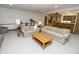 The finished basement offers multiple seating areas and a wet bar, perfect for entertaining guests at 7400 Oakbay Dr, Noblesville, IN 46062