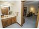 Bathroom featuring a sink, vanity, and doorway into the Primary bedroom at 7400 Oakbay Dr, Noblesville, IN 46062