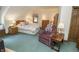 Bedroom with bed, chair, and natural light at 7400 Oakbay Dr, Noblesville, IN 46062