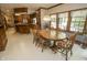 Bright dining area connected to the kitchen, featuring a wooden table and ample natural light at 7400 Oakbay Dr, Noblesville, IN 46062