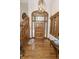Foyer featuring a beautiful wood door, staircase, and hardwood flooring at 7400 Oakbay Dr, Noblesville, IN 46062