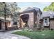 Charming brick home featuring a covered front entrance with arched details and manicured landscaping at 7400 Oakbay Dr, Noblesville, IN 46062