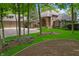 Beautiful home with lush landscaping, mature trees, and an attached two-car garage at 7400 Oakbay Dr, Noblesville, IN 46062