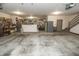Spacious garage featuring ample room for storage, tool racks, and parking with access door at 7400 Oakbay Dr, Noblesville, IN 46062